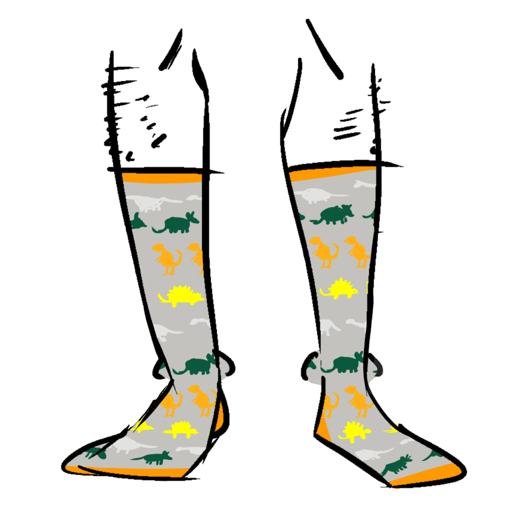 Grey socks with silhouettes of dinosaurs on them. Dinosaurs are green, white, orange, and yellow.