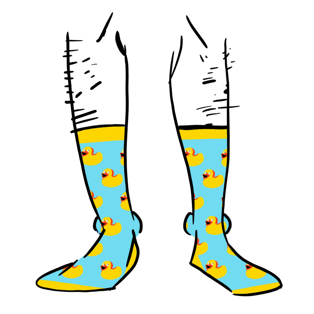 Light blue socks with a pattern of yellow rubber duckies on them