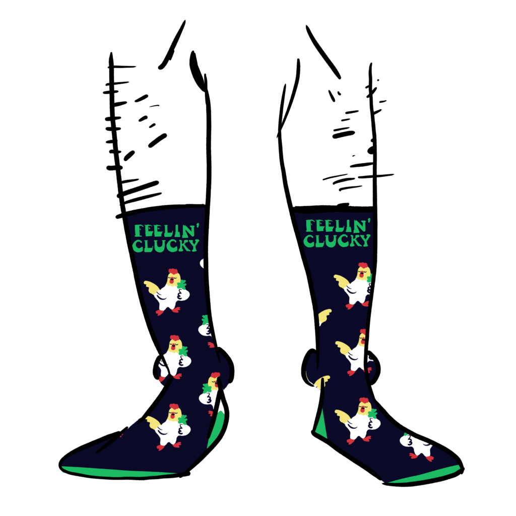 Black socks with a pattern made up of chicken holding a shamrock. Text says Feelin' Clucky.