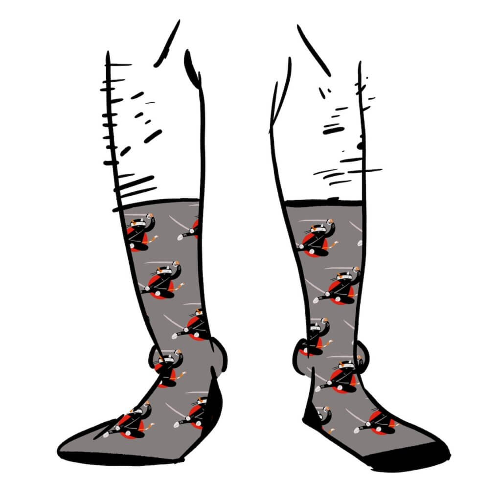 Grey socks with cats dressed as ninjas on them.